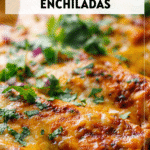 A pan of Easy Cheesy Ground Beef Enchiladas topped with melted cheese and garnished with fresh herbs for dinner recipes beef ground. 2